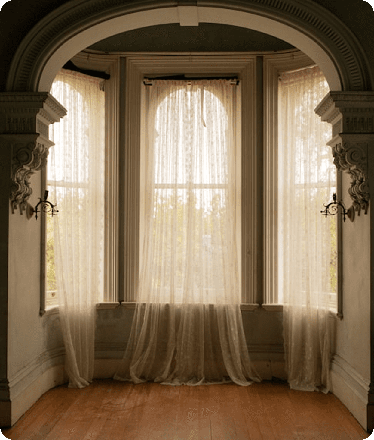 Elegant arched window with curtains